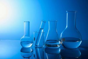 Scientific experimentation taking place in a laboratory.  Wallpaper