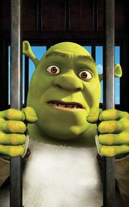 Shrek Captured: Unlikely Hero in a Cage shrek wallpaper