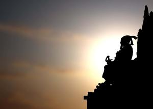silhouette of a man sitting on top of a statue shivaji maharaj wallpaper