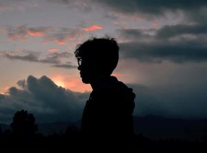 silhouette of a person standing in front of a sunset instagram profile wallpaper
