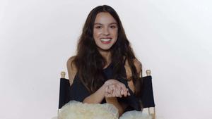 Singer-songwriter Olivia Rodrigo performing on stage olivia rodrigo wallpaper
