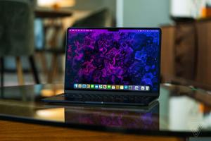 Sleek and Contemporary Laptop on a Wooden Surface laptop wallpaper