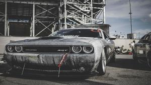 Sleek Red Sports Car in Dramatic Night Scene Wallpaper