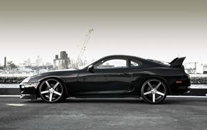 Sleek silver Toyota Supra parked on a racetrack supra wallpaper