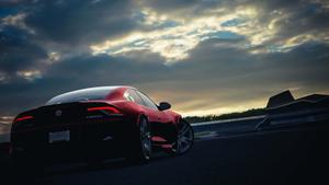 Sleek Supercar on a Stunning Race Track Wallpaper