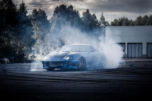 Sleek Supra Sports Car on an Open Road supra wallpaper