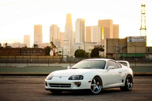 Sleek Toyota Supra Sports Car on the Open Road supra wallpaper
