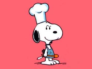 Snoopy, the joyful beagle, smiles at the soft autumn leaves. snoopy wallpaper