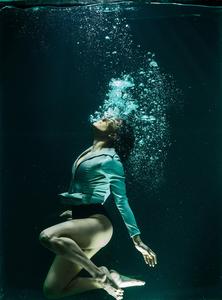 Solitude Underwater: Girl Embracing Her Solitude Under the Depth of Blue Waters alone girl wallpaper