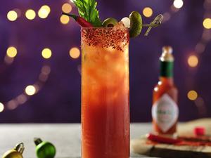 Spicy Bloody Mary cocktail garnished with crisp jalapenos. Wallpaper