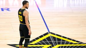 Stephen Curry taking a three-point shot in a basketball game stephen curry wallpaper