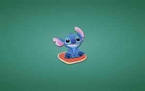 Stitch snuggled up on a comfy pillow! Wallpaper