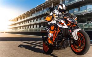 Streaking Neon Orange Motorcycle 8k wallpaper