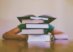 Study Motivation Tall Stack of Books on Table study motivation wallpaper