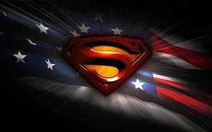 Superman stands tall with an American Flag. superman wallpaper