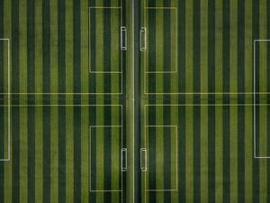 Take control of the game on the Striped Football Field football wallpaper