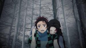 Tanjiro Carrying Nezuko in Demon Slayer Wallpaper