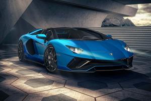 the blue lamborghini huracan is parked in front of a building lamborghini wallpaper