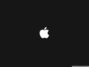 The classic Apple logo in white on a black background Wallpaper