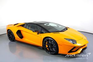 the orange lamborghini huracan is parked in a white room lamborghini wallpaper