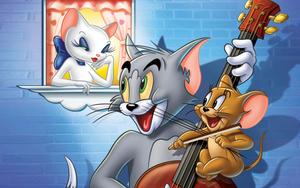 Tom and Jerry in a playful chase. tom and jerry wallpaper
