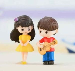 two figurines of a boy and girl playing guitar whatsapp dp wallpaper