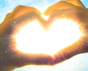 two hands making a heart shape with the sun behind them romantic love wallpaper