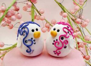 two penguins sitting on top of a pink cake whatsapp dp wallpaper