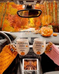 two people holding pumpkin mugs in the car fall aesthetic wallpaper