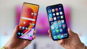 two people holding two smartphones in their hands
