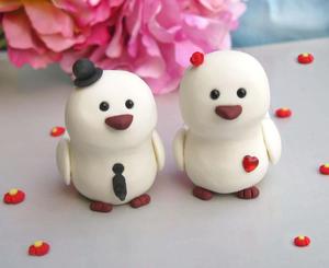 two white wedding cake toppers with a bow on them whatsapp dp wallpaper