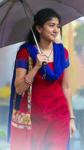 Versatile Actress Sai Pallavi Bracing the Rain with an Umbrella sai pallavi wallpaper