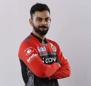 virat kohli in a red and black ipl uniform rcb wallpaper