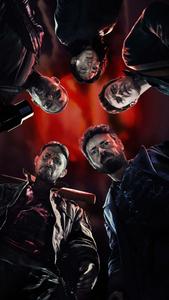 Young boy using the latest smartphone Wallpaper