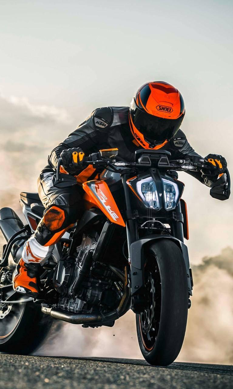 4K Bike Rider On Orange Bike — 768x1280 wallpaper