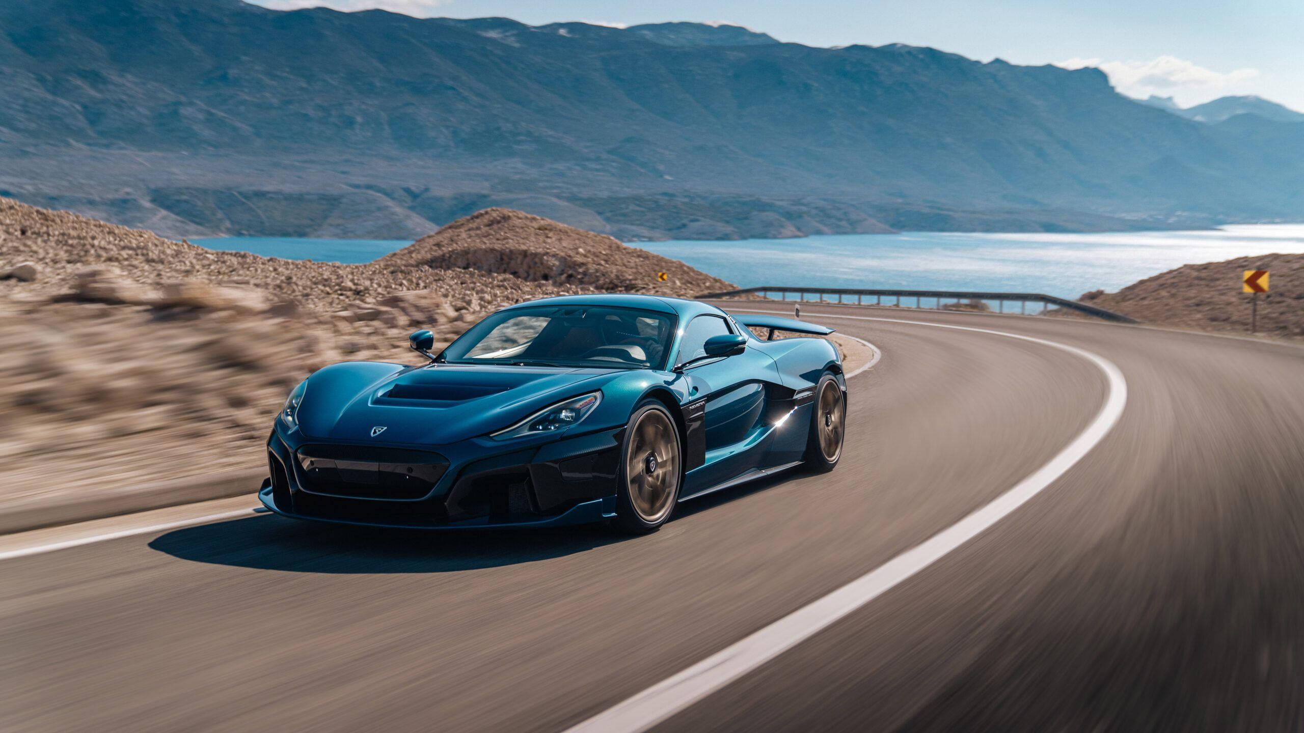 4K Blue Car Driving On Road — 2560x1440 wallpaper