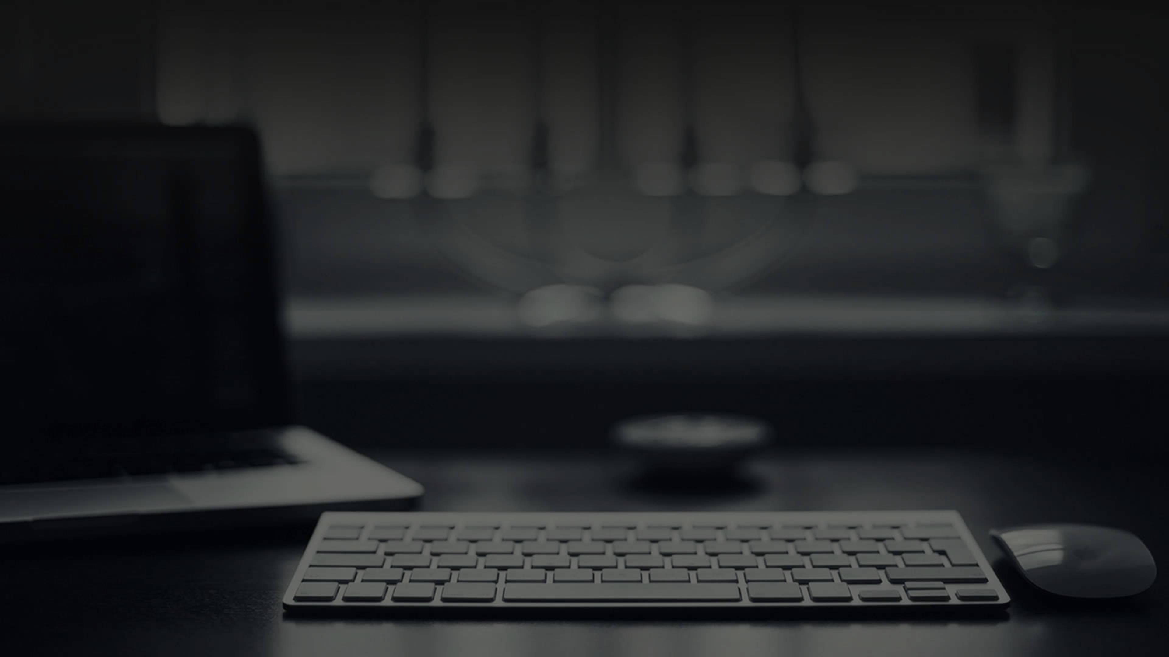 4K Laptop On Gloomy Desk — 3840x2160 wallpaper