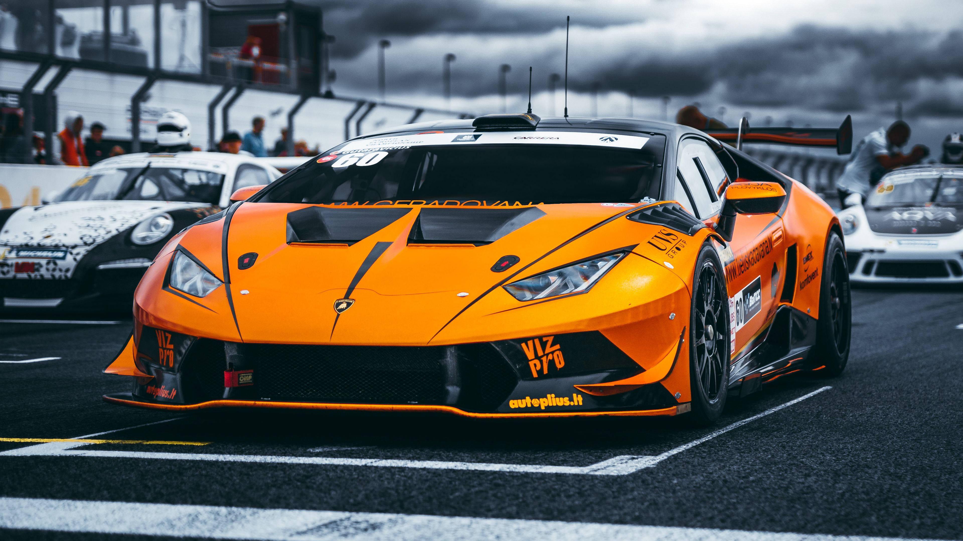 4K Orange Car Among White Cars — 3840x2160 wallpaper