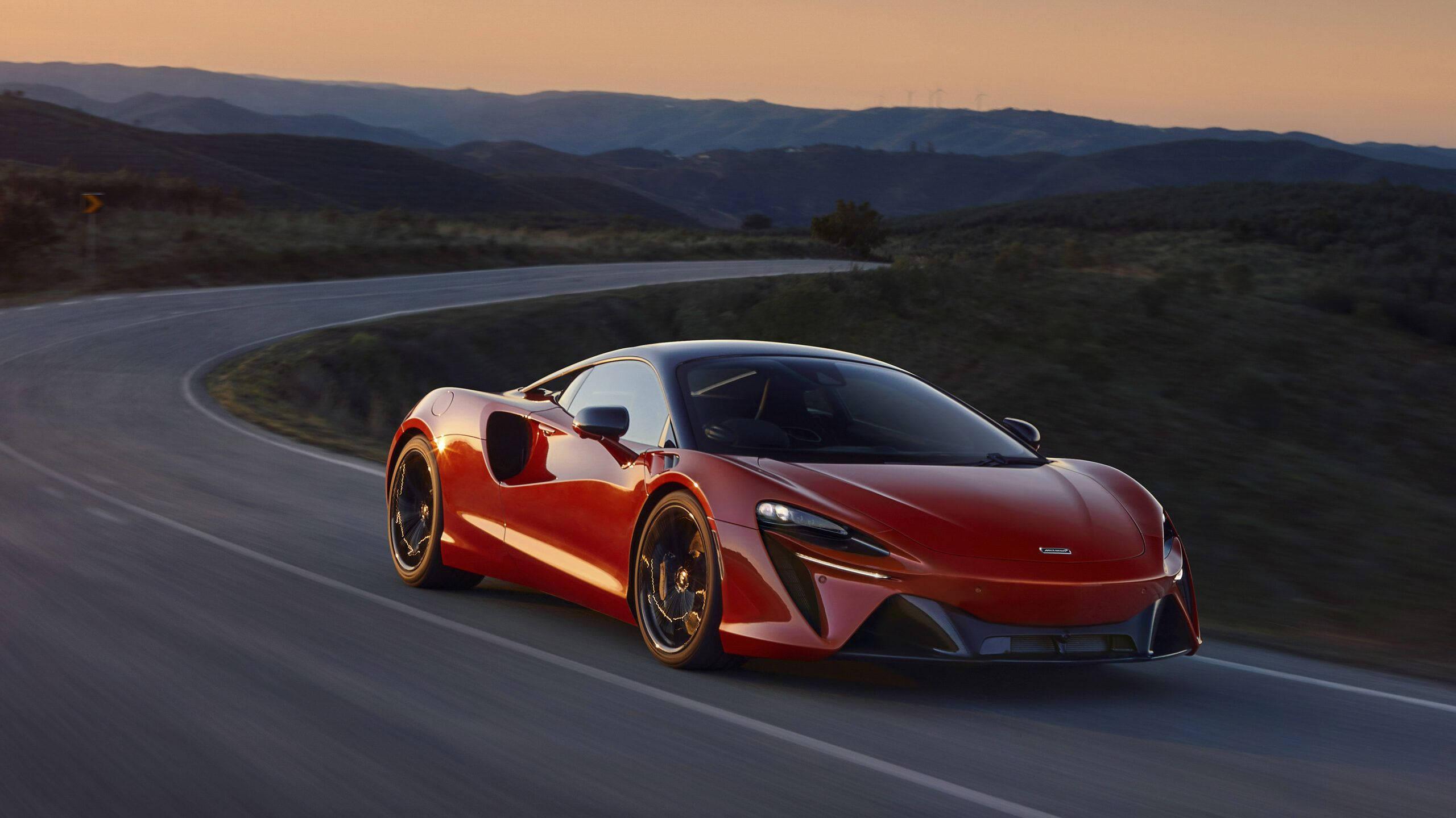4K Red Car Speeding At Sunset — 2560x1440 wallpaper