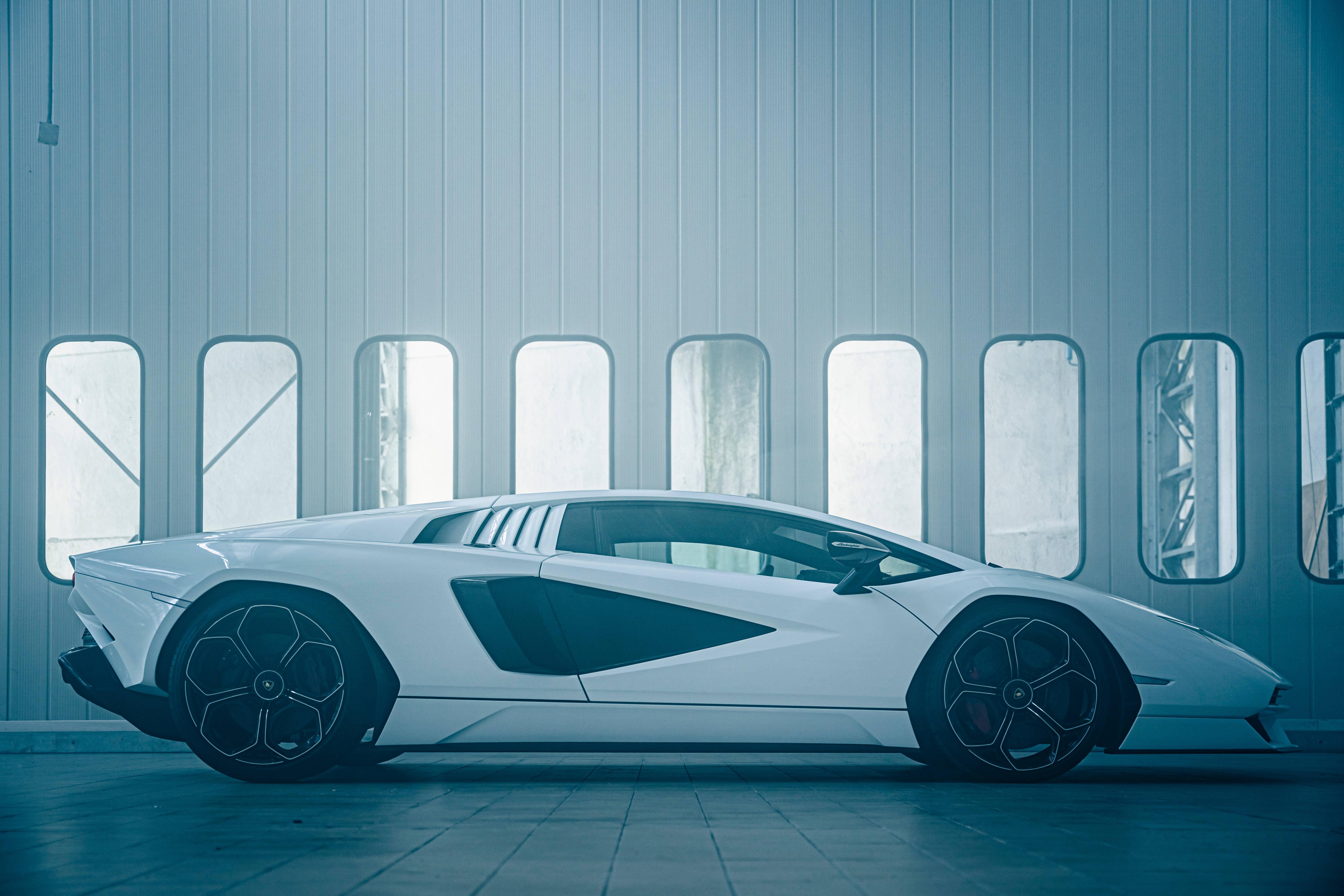 4K White Car Next To Windows — 5727x3818 wallpaper