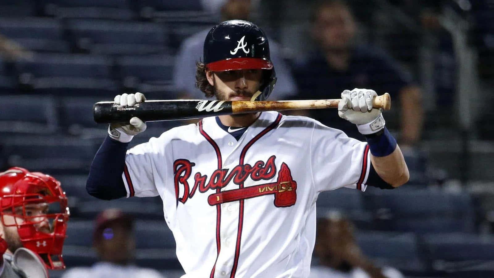 a baseball player is holding a bat while he is on the field — 1600x900 wallpaper