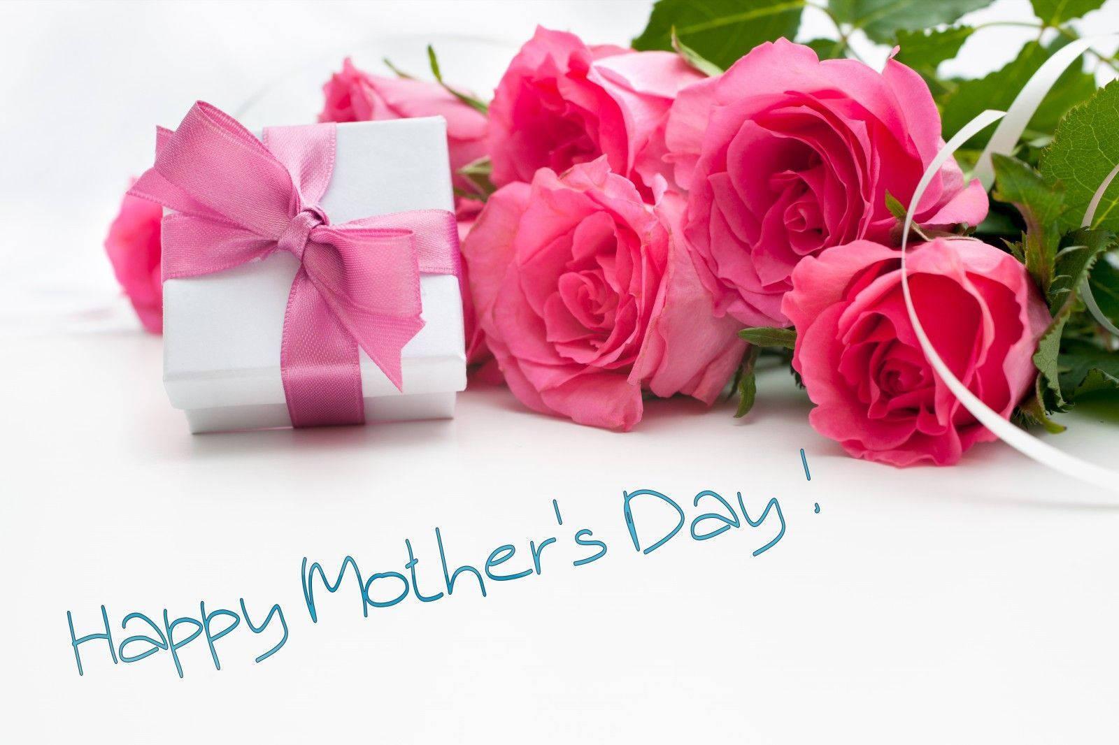 A beautiful presentation of pink roses and gift, just the perfect Mother's Day surprise — 1600x1066 wallpaper