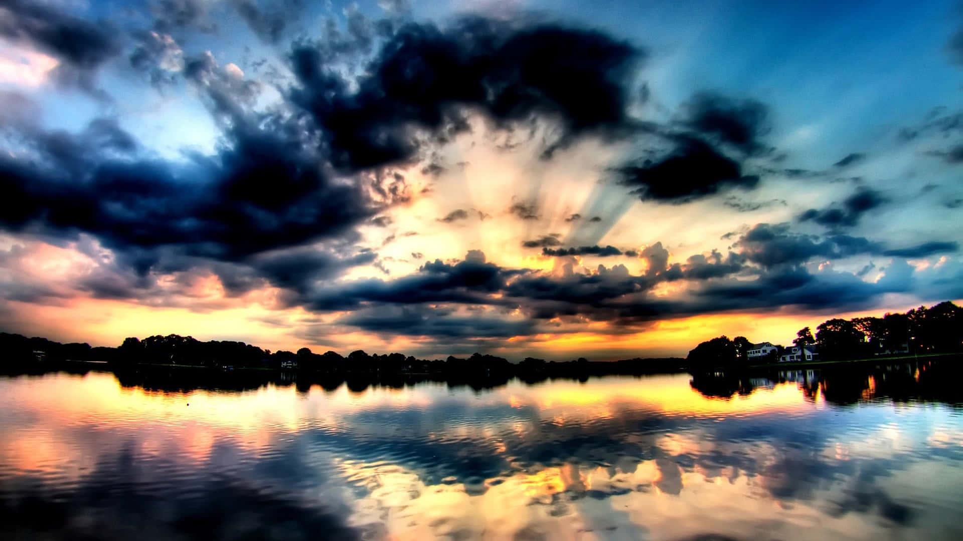a beautiful sunset over a lake with clouds — 1920x1080 wallpaper