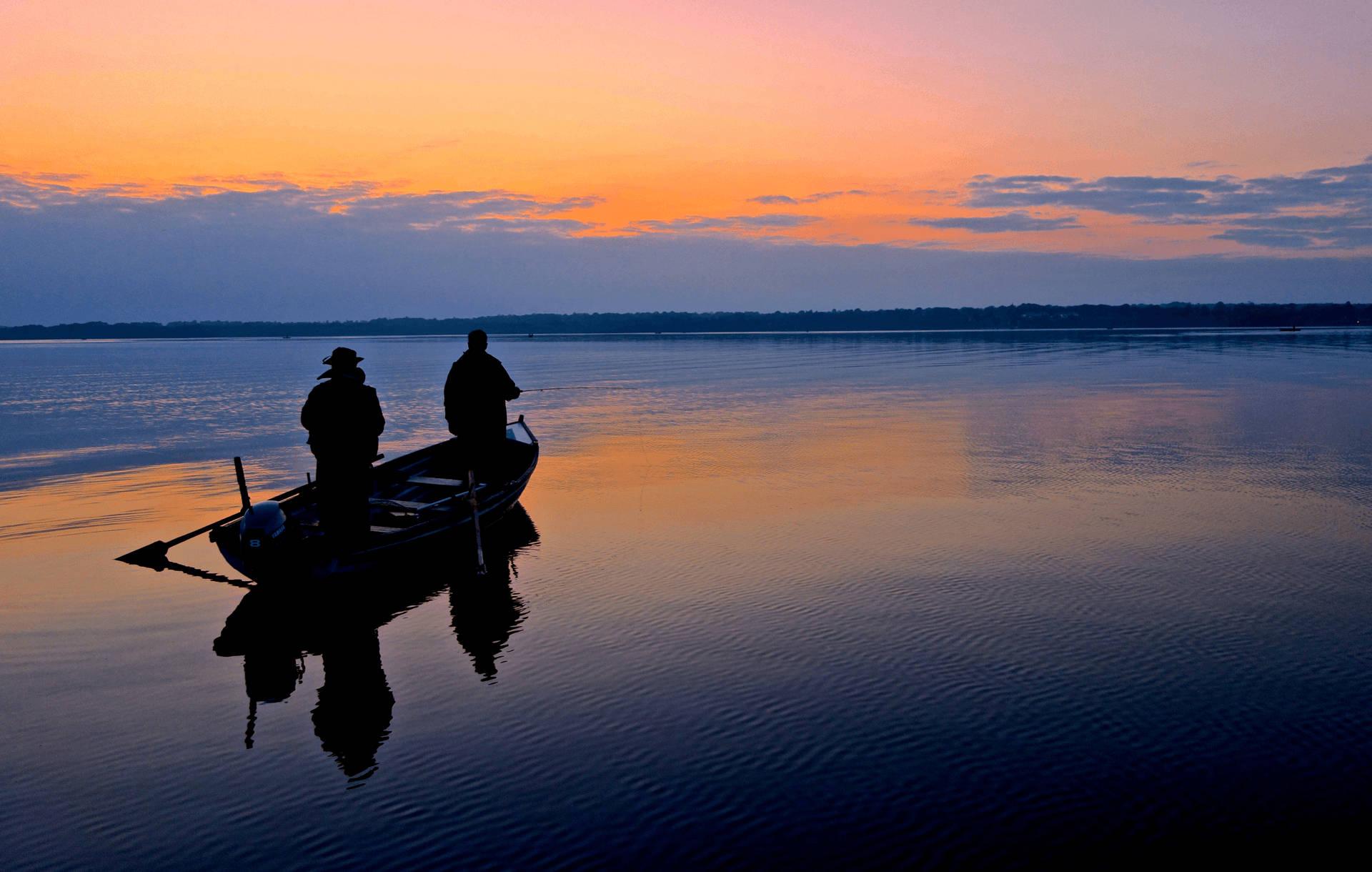 A beautiful sunset view of a peaceful lake, perfect for a fishing adventure! — 1920x1220 wallpaper