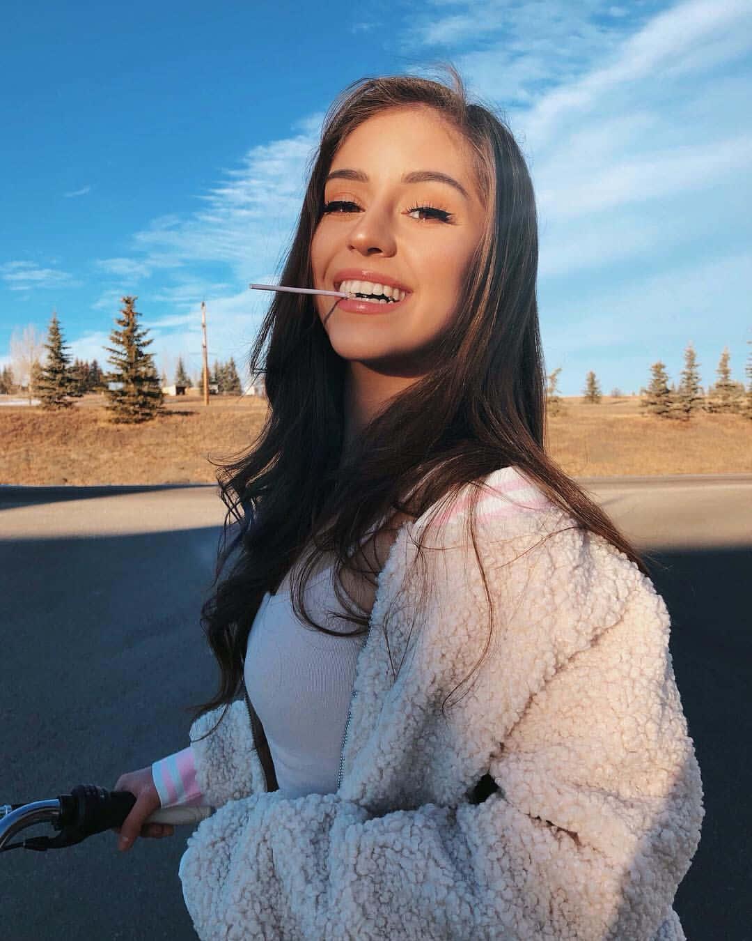 A beautiful young girl enjoying time outdoors — 1080x1350 wallpaper