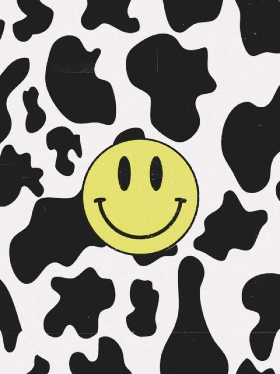 a black and white cow print with a smiley face — 900x1199 wallpaper