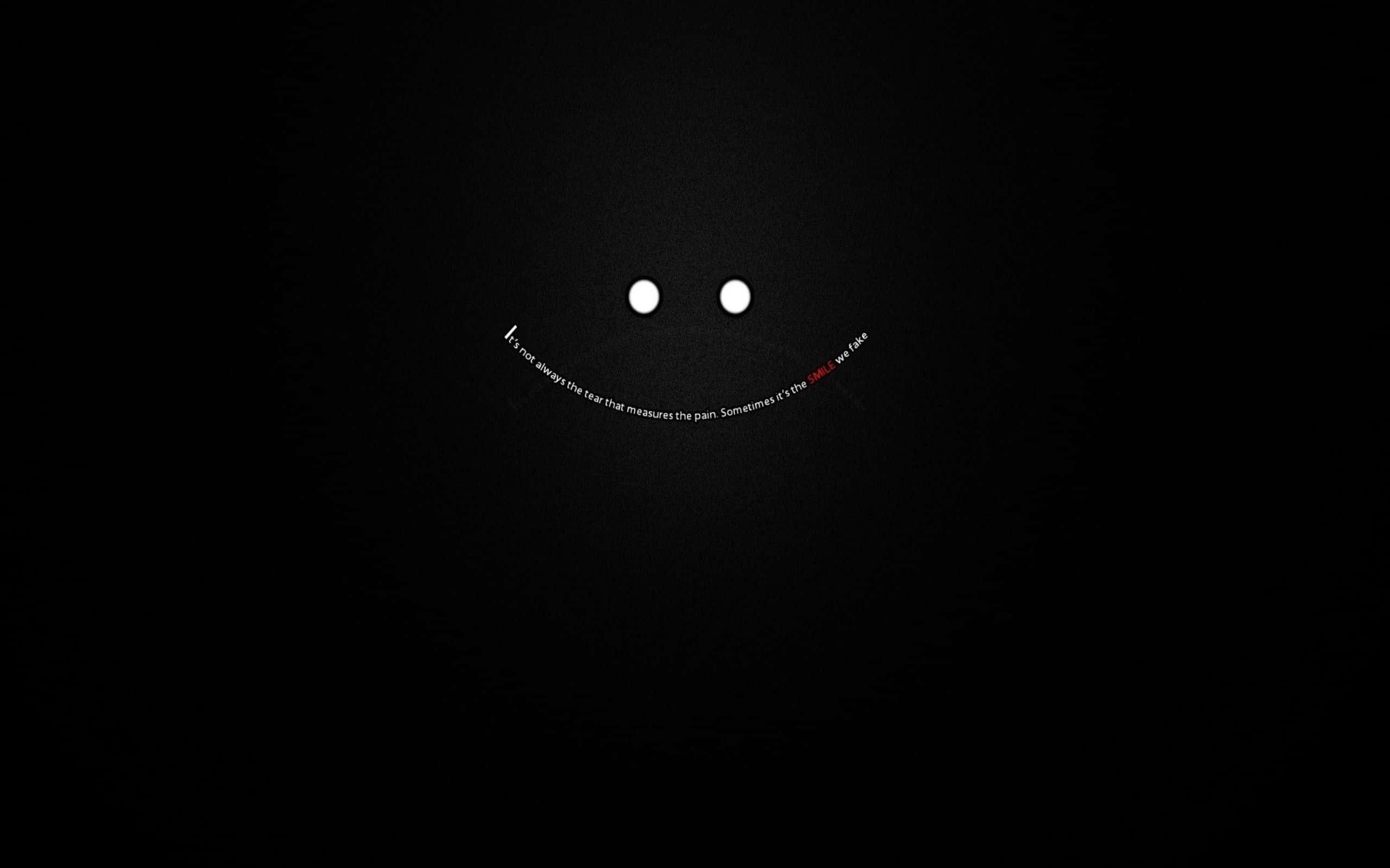 a black background with a smiling face — 2560x1600 wallpaper