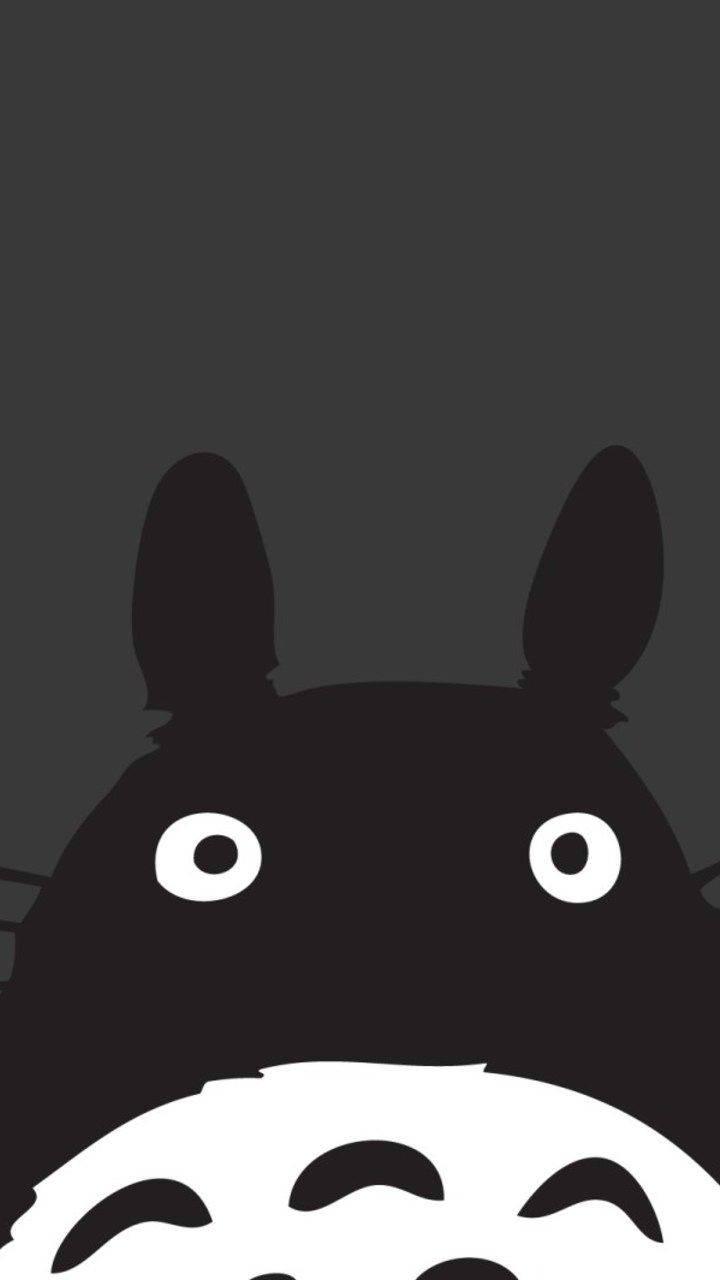 A black Totoro, standing among plants — 720x1280 wallpaper