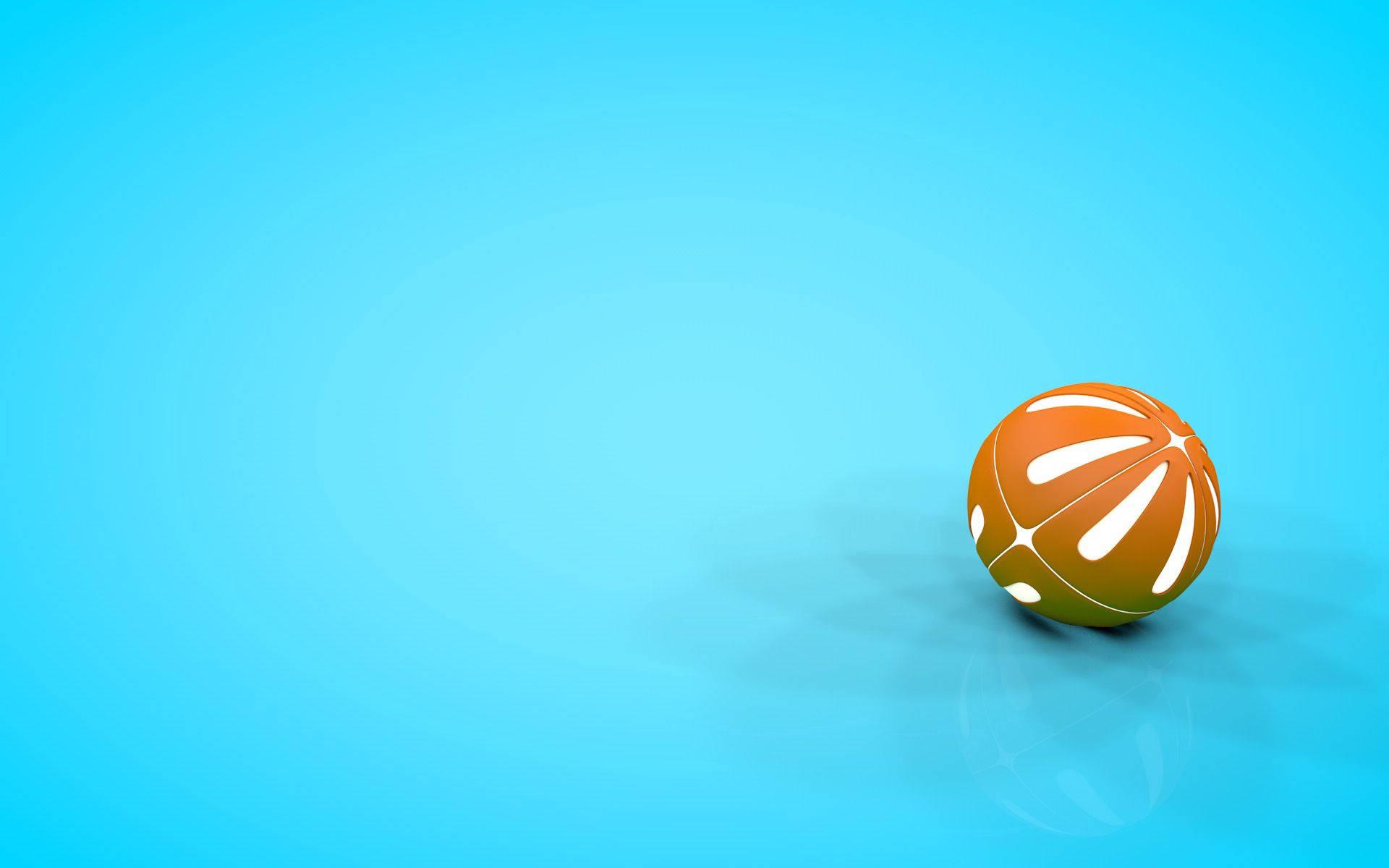 A bright orange beach ball floating against a pristine blue sky — 1920x1200 wallpaper