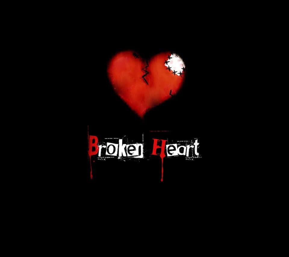 A Broken Heart Shattered on a Dark Black Background — 960x854 wallpaper